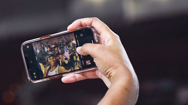 South Carolina forward Aliyah Boston (4) takes a selfie with her family after beating Maryland in the NCAA Women's Elite Eight Basketball Tournament at Bon Secours Wellness Arena in Greenville, S.C. Monday, March 27, 2023. Gre Ml Ncaaelite8uscvmd 03272023 022